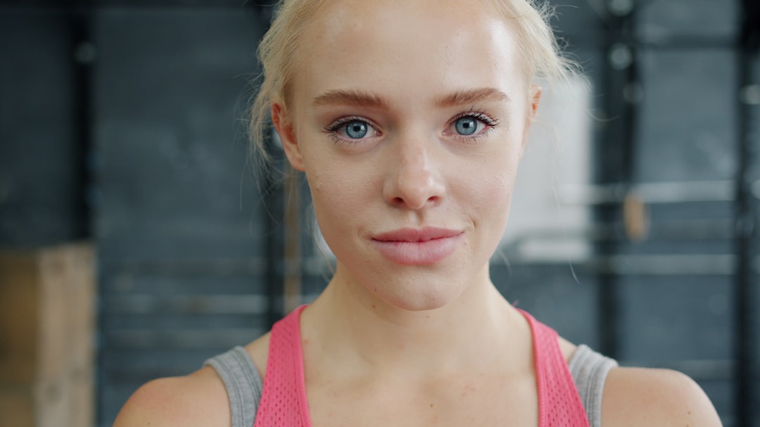 Young woman with blonde hair in gym
